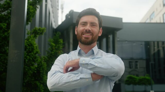 Confident pensive Caucasian middle aged adult man thinking looking away ponder male guy business employer businessman manager turn head to camera smiling crossed hands posing in city office building