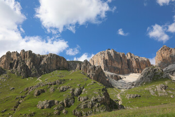 Panoramic view of Dolomite mountain range in the European Alps and the arrival of the cable car at the top of Mount Sass Pordoi in northern Italy