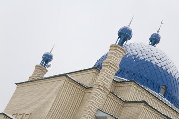 Beautiful Muslim mosque in blue skies and grass