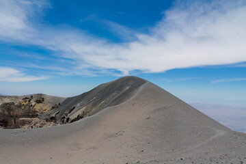 Volcano crater inside. Lava, ash, smoke and rocks inside of volcano crater. Volcano El Misti. Peruvian volcanic summit of the mountain in the Andes.