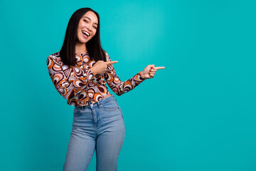Photo of pretty young woman direct fingers empty space wear top isolated on teal color background