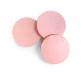 Slices of tasty boiled sausage isolated on white, top view