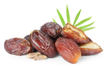 Tasty dried dates, seeds and leaf isolated on white
