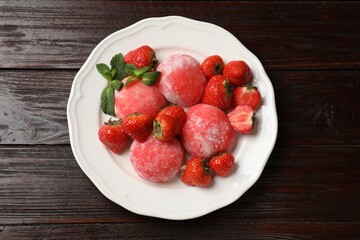 Delicious mochi, strawberries and mint on wooden table, top view
