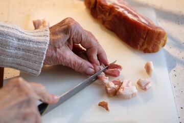 Close-up of bacon during the preparation, cutting and cooking process