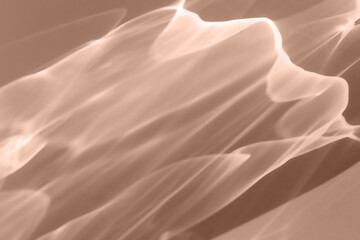 Abstract sunlight background mocha mousse colored, natural glare from sunlight, trend color year...