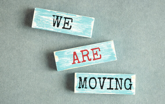 we have moved word written on wood block. we have moved text on wooden table for your desing, concept.