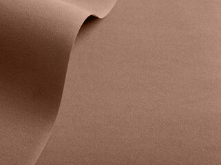 Paper background in mocha mousse color, trendy colour of 2025 year
