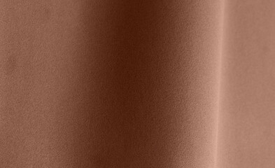 Textured paper backdrop in the fashionable mocha mousse hue