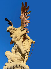 Obraz premium The Archangel Michael holding the devil at bay