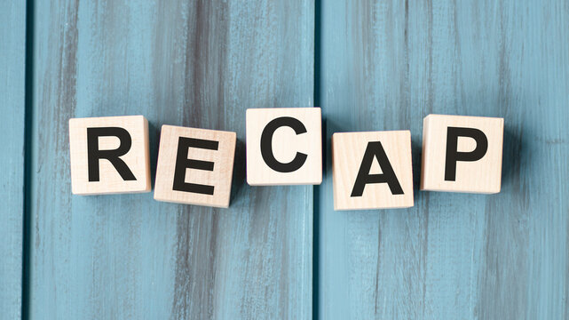 concept word recap on wooden cubes on a gray background