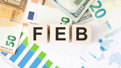 FEB text made of wooden cube on White background.