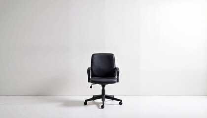 Black office chair in minimal space with white walls