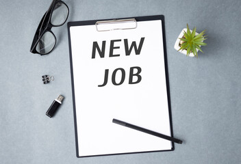 New job word on notepad on working table