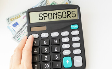 Word SPONSORS on calculator. Finance and business concept