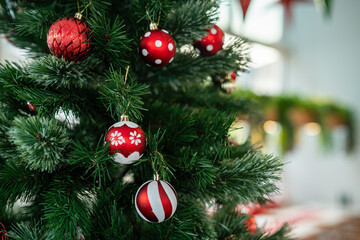 Merry x-mas,Close up of Colorful balls ,gifts box and Christmas greeting picture parcel,bell decoration on Green Christmas tree background Decoration During Christmas and New Year.