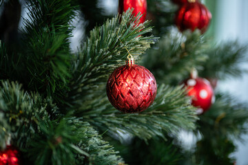 Merry x-mas,Close up of Colorful balls ,gifts box and Christmas greeting picture parcel,bell decoration on Green Christmas tree background Decoration During Christmas and New Year.