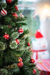 Merry x-mas,Close up of Colorful balls ,gifts box and Christmas greeting picture parcel,bell decoration on Green Christmas tree background Decoration During Christmas and New Year.