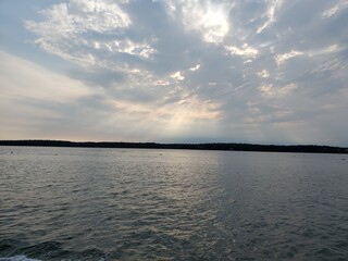Sun shining through the clouds over the Atlantic Ocean