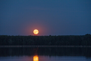 moonrise in the evening over the lake
