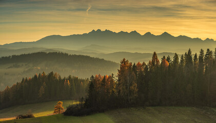 panorama of the Tatra Mountains, golden hour light, autumn