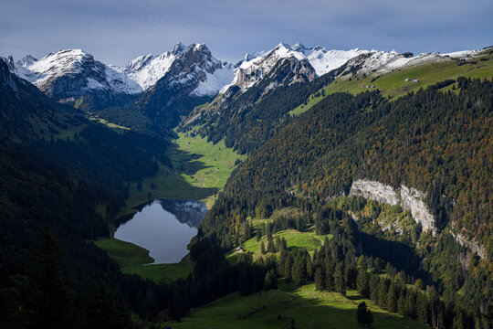 swiss mountains landscape with lake and peaks of alpstein in autumn