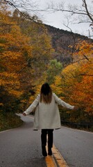Woman On Scenic Autumn Road