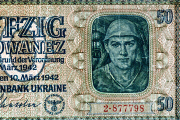 Obraz premium Vintage elements of old paper banknotes.Old 50 karbovanez bill of Ukraine. Occupying the money of the German Reich in 1942,Rovno