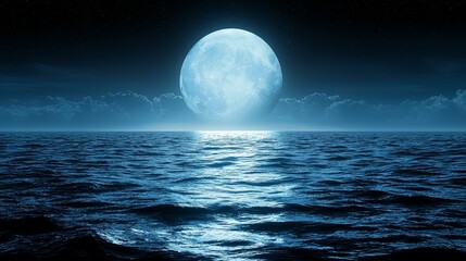 A full moon rising over the ocean at night