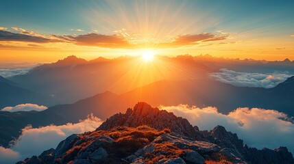 Fototapeta premium A view of the sun setting over the mountains from the top of a mountain