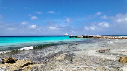 Fototapeta premium Caribbean Beach At Willemstad In Netherlands Curacao. Idyllic Beach. Nature Landscape. Willemstad At Netherlands Curacao. Tourism Background. Island Seascape.