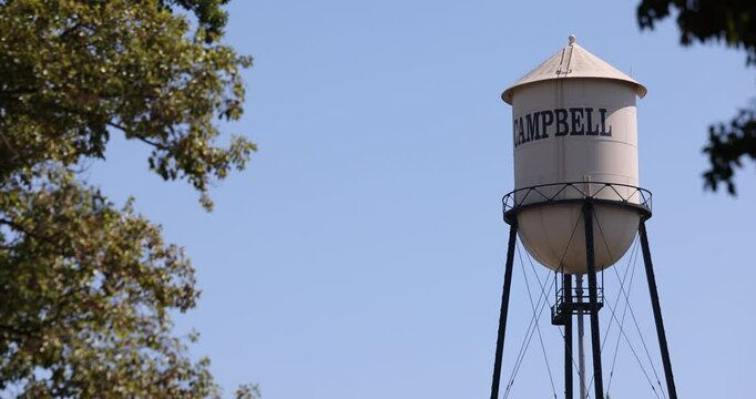 Campbell, California, USA - August 29, 2024: Afternoon sun shines on historic 1928 steel water tower of downtown Campbell.