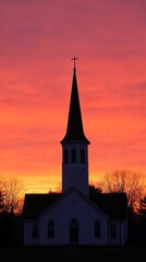 Fototapeta premium Church Silhouette at Sunset: A striking silhouette of a church stands tall against a vibrant sunset, its steeple reaching towards the heavens. The image evokes a sense of peace, faith, and hope.