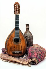 Antique guitar, ornate vase, patterned rug.