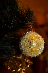 golden decoration ball on a christmas tree