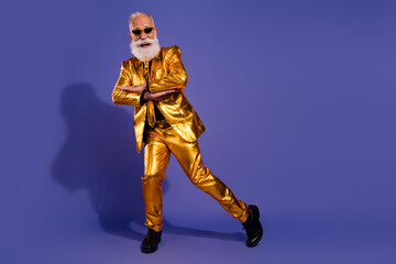 Full body photo of bearded gentleman have fun dancing wear fashionable golden clothes isolated on violet color background