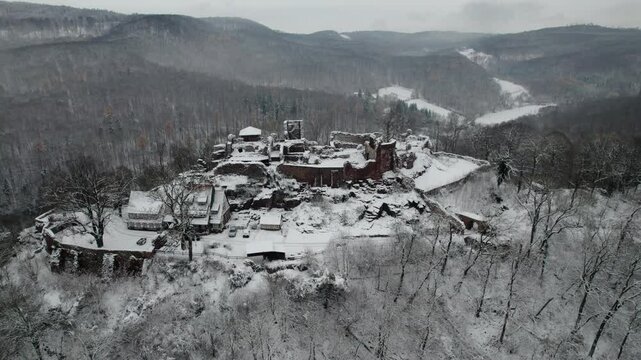 Aerial view ruins of old castle. Winter. Ruin of Hohnstein Castle, Harz mountains, Germany.
