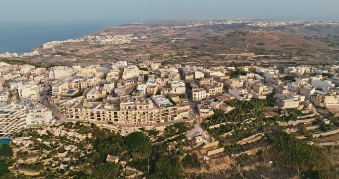 Aerial Perspective of Zebbug Parish Church and Historic Cityscape on Gozo Island in Malta with Stunning Mediterranean Views. High quality 4k footage