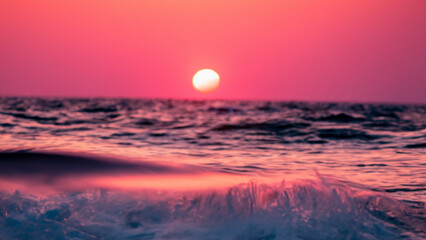 Obraz premium Inside a breaking wave. A split moment of beauty. Sunset.