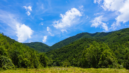 Green mountain with sky clouds natural landscape at sunny weather.