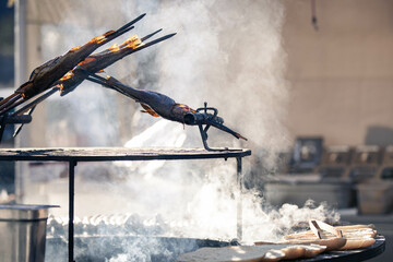 smoked fish over open fireplace