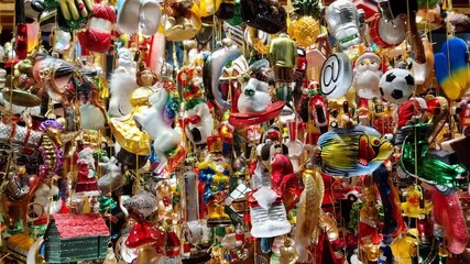 Christmas glass decorations for sale on a shop window, decorative hand painted ornament for the christmas tree. 4K