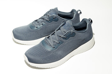 Modern lightweight running shoes displayed on a clean surface showcasing a sleek design suitable...