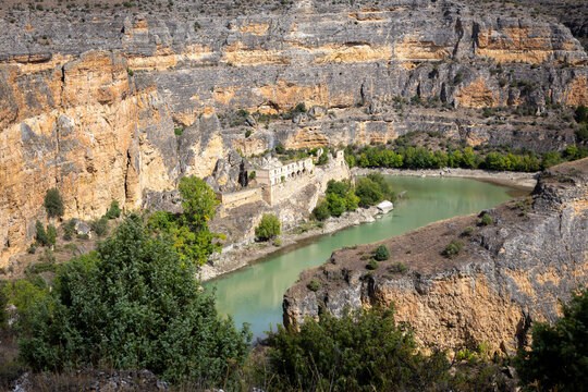 Hoces del Rio Duraton Nature Reserve landscape with the convent of Nuestra Senora de los Angeles de la Hoz del Rio Duraton (Monastery of Our Lady of the Angels of the Hoz) ruins, Spain.