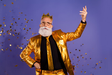 Fototapeta premium Photo portrait of bearded gentleman confetti performance wear fashionable golden clothes isolated on violet color background