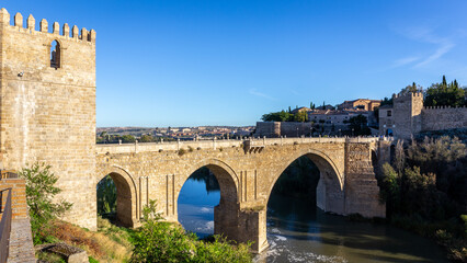 The San Martin Bridge, medieval bridge over the Tagus River with crenellated towers, Toledo, Spain.