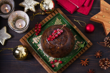 Fruit cake pudding and Christmas decorations. Fruitcake ball, traditional dessert on Christmas. Top view with copy space