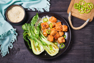 Salmon teriyaki with pak choi and rice. View from above, top studio shot