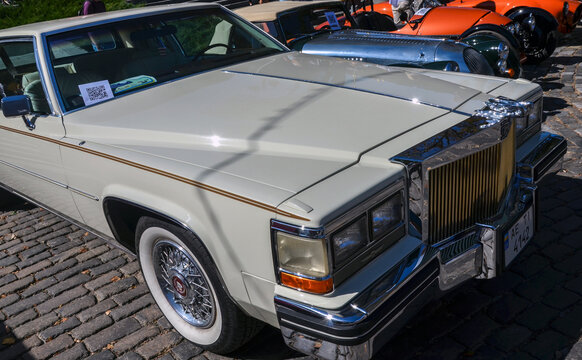 Luxurious iconic white sedan 1990 Cadillac DeVille that exemplifies American automotive elegance early '90s
