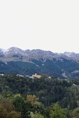 Scenic View of Alpine Landscape and Mountains with Village on Hillside in Innsbruck, Austria